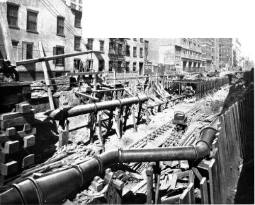 LARGE GAS AND WATER PIPES, RELAID BEHIND EACH SIDE WALL ON ELM STREET