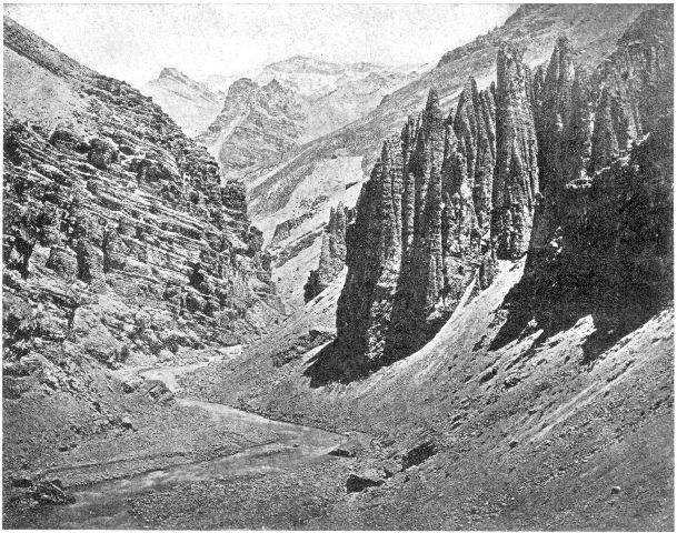 Mountain gorge, Himalayas, India. Note the difference in the slope of the eroded rocks and the effect of erosion upon them; also the talus slopes at the base of the cliffs which the torrent is cutting away. On the left of the foreground there is a little bench showing a recent higher line of the water.