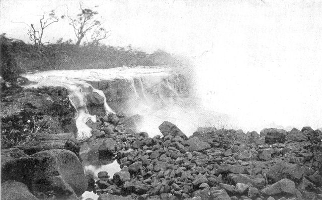 Lava stream, in Hawaiian Islands, flowing into the sea. Note the "ropy" character of the half-frozen rock on the sides of the nearest rivulet of the lava.