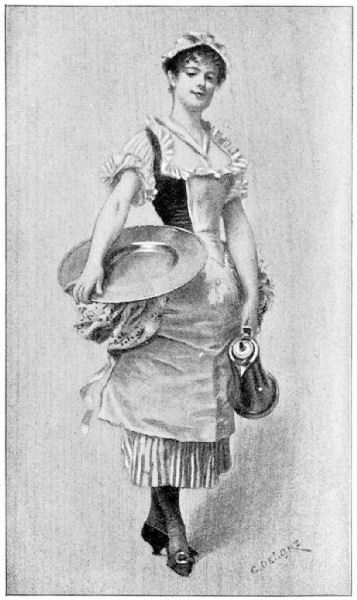 A smiling young woman wearing a floral panniered striped skirt, short puff-sleeved white shirt and dark coloured bodice, along with an apron and curly hair pinned up under a simple white cap, stands in a jaunty pose. She holds a large lidded metal jug in her left hand, and has a large circular metal platter resting against her right hip, supported by her right hand.