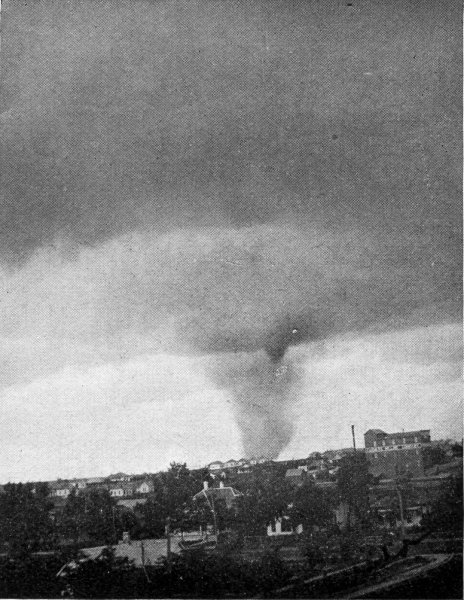 True tornado forming in advance of a dust whirl.