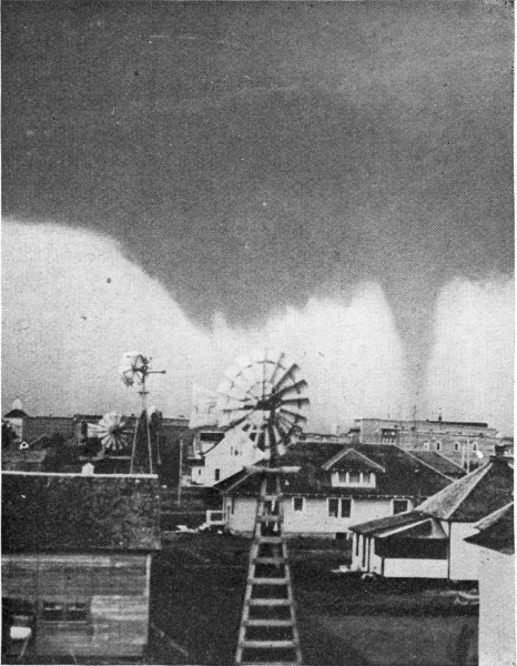 Tornado dropping towards ground.