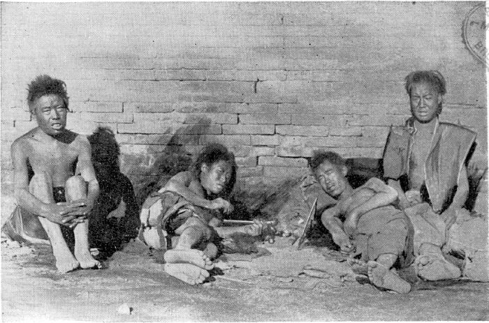 OPIUM-SMOKERS IN A STREET OF TAI-YUEN-FOO.