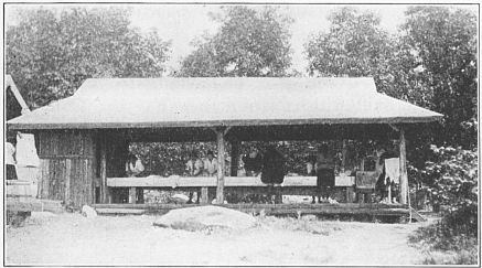 The Wash House for Personal and Laundry use. Faucets hang from above. Inclined trough between two shelves, the whole, zinc covered, runs length of house. Two soapstone tubs for extra hard scrubbing at right. Special compartment at left for officers.