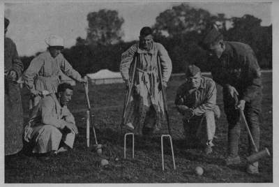 "NEVER SAY DIE" Sorely wounded, our boys at the great A. R. C. field hospital in the Auteuil race track outside of Paris, kept an active interest in games and sports 