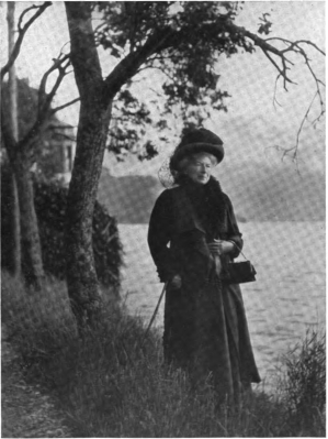 MRS. WARD BESIDE THE LAKE OF LUCERNE. 1912 FROM A PHOTOGRAPH BY MISS DOROTHY WARD