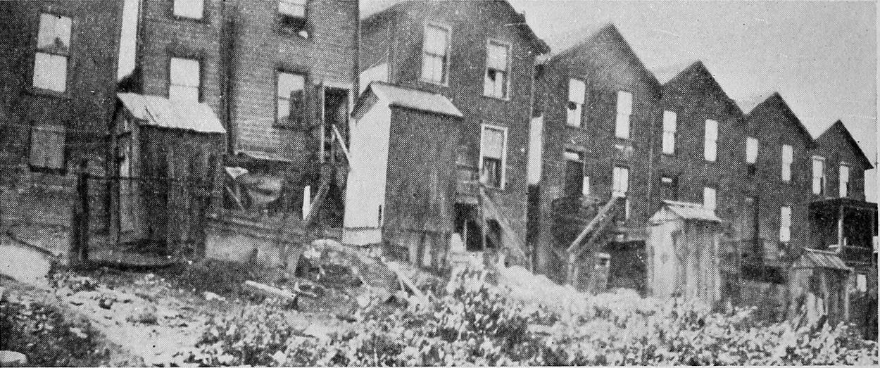 A Row of Houses Unused for Several Years Until the Present Influx from the South.