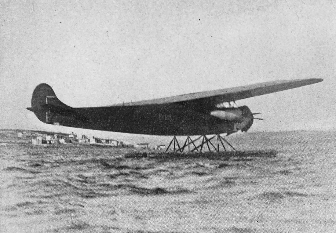 Photo wide shot of tri-motor airplane floating on water