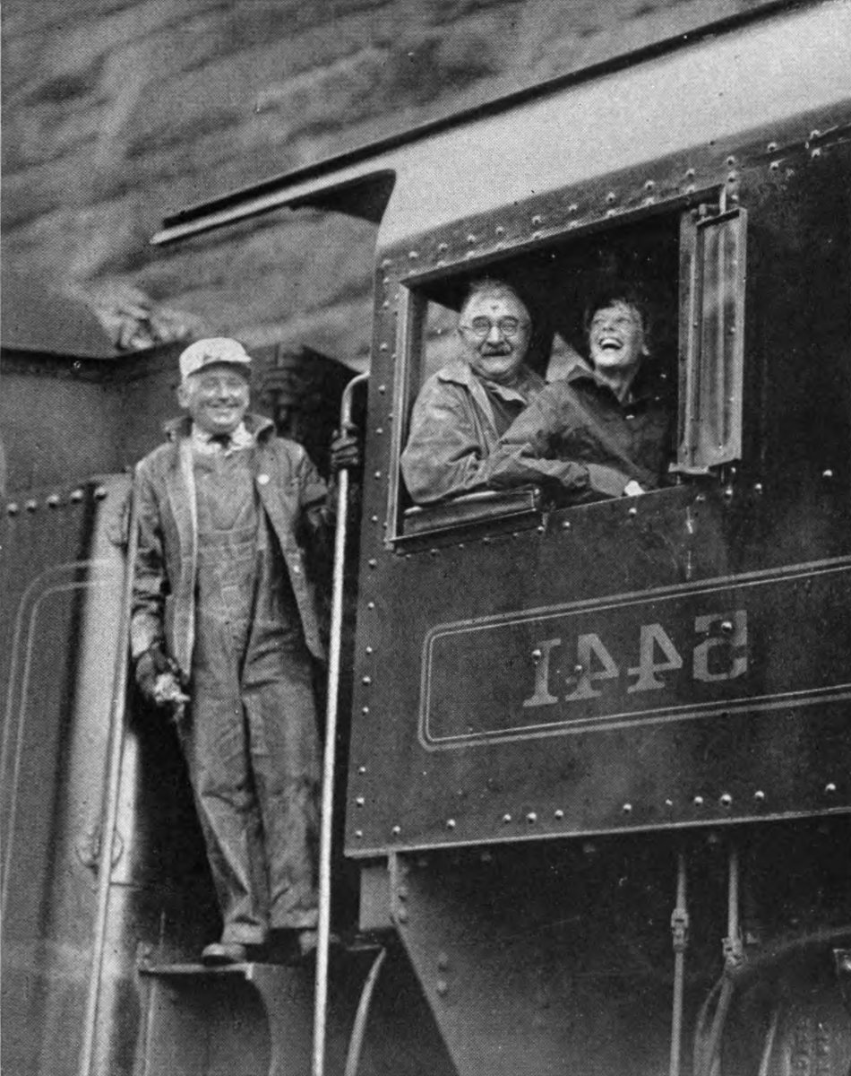 Photo of Earhart looking out window of a locomotive