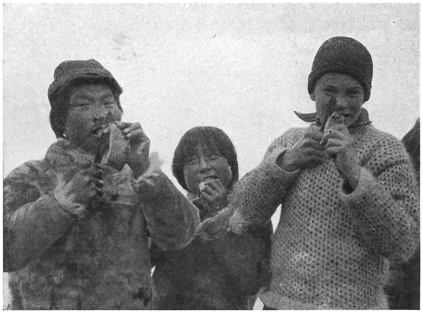 Kudluktoo and Matak Show David the Right Way to Eat Narwhal Hide, a Prized Eskimo Delicacy.