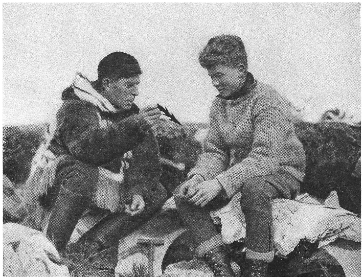 Dr. Rasmussen Shows David an Ancient Eskimo Harpoon Head.