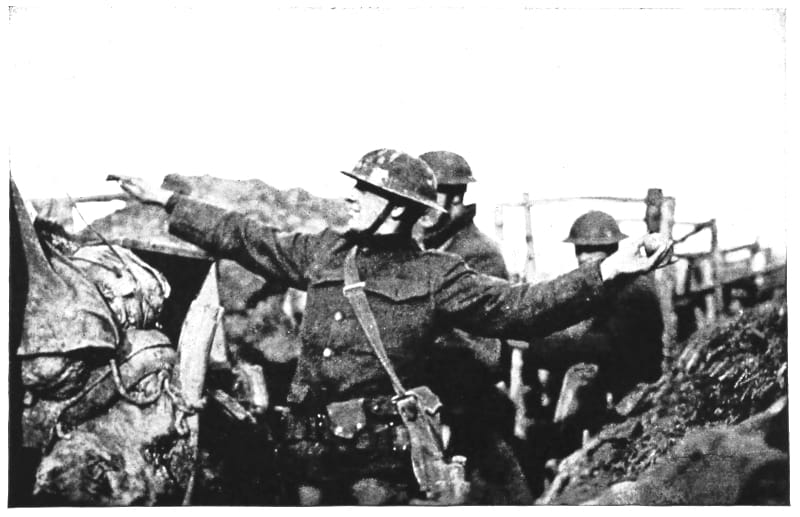 A uniformed man throwing an explosive.