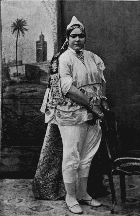 A TUNISIAN JEWESS IN STREET DRESS.