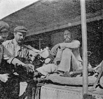 Neufeld on Gunboat "Sheik"&mdash;Cutting off his
Ankle-Irons.