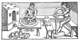 Fig. 25.&mdash;Venetian Potters of the Sixteenth Century.
Showing two kinds of potter’s wheels in use among them. (From engraving
by V. Biringuccio.)