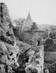 SHEIKH ADI.
The upper end of the buildings showing the forecourt and entrance
gateway: and (apparently) “the Proprietor,” seated on the wall above.